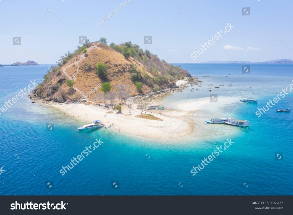 stock-photo-aerial-view-by-drone-the-beautiful-kelor-island-with-beautiful-landscape-sandy-beach-blue-ocean-1507166477