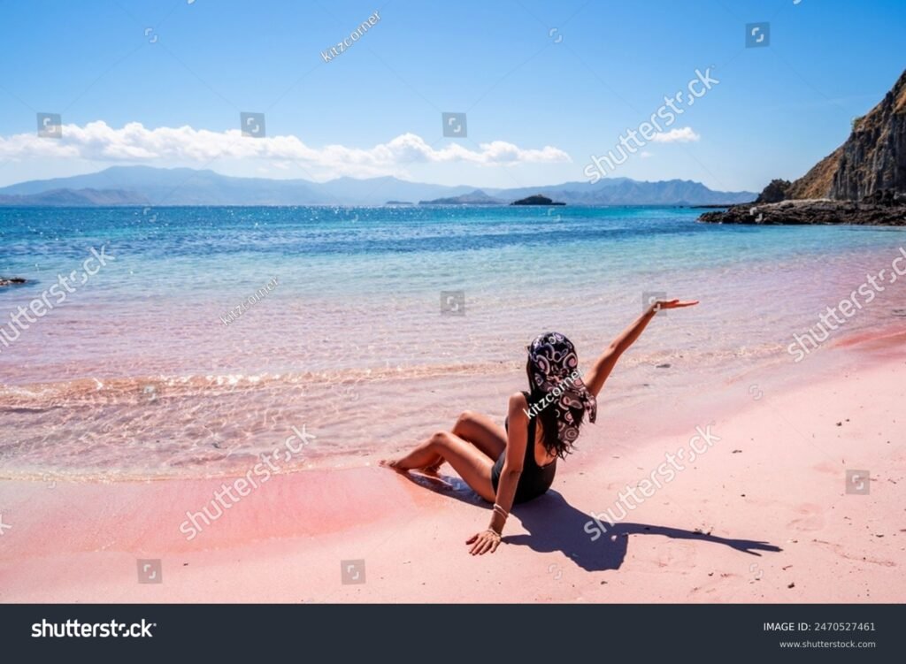 stock-photo-young-female-tourism-enjoying-the-tropical-pink-sandy-beach-with-clear-turquoise-water-at-komodo-2470527461 Pink Beach